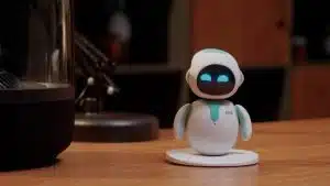 The Eilik Desktop Companion Robot on a wooden desk with a dark background