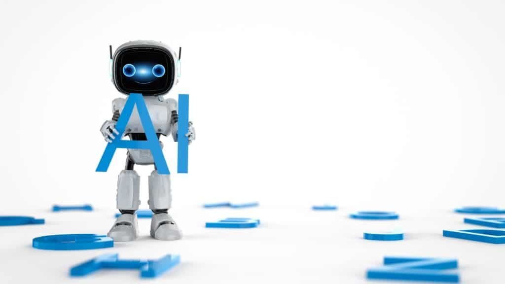 An image of desktop robot holing up the letters A.I.