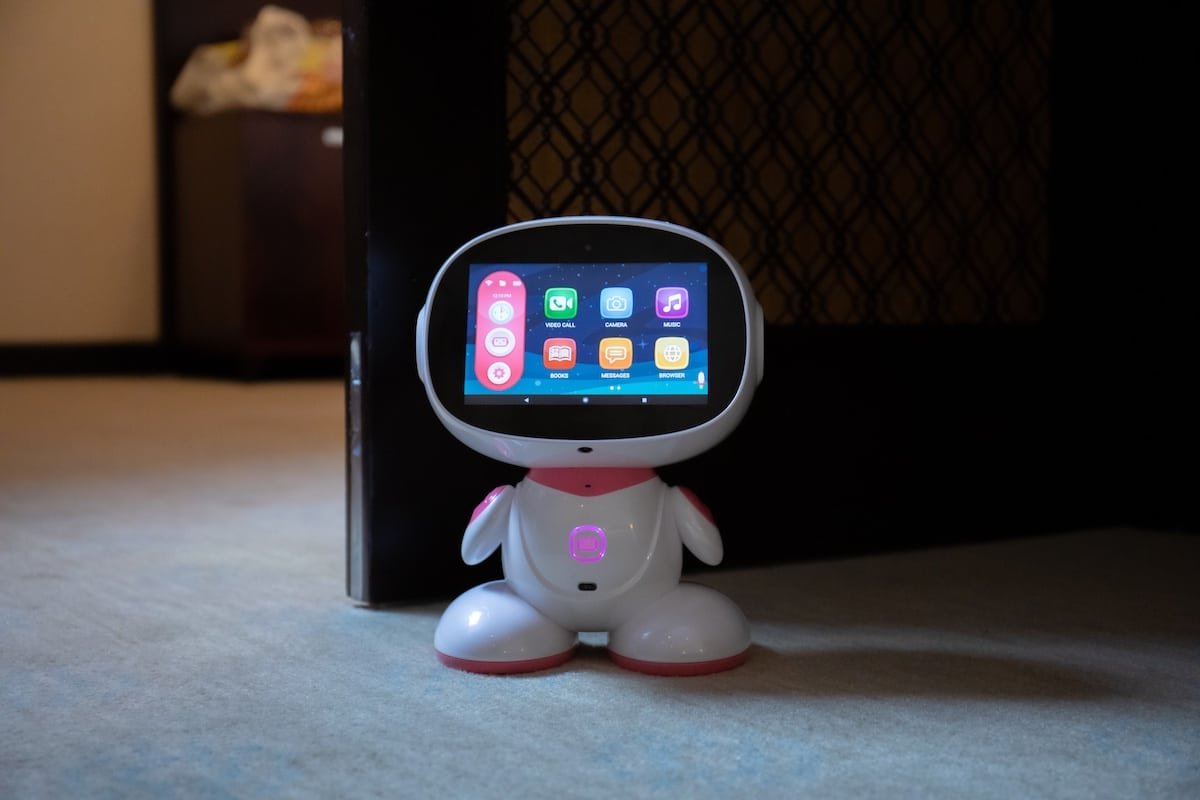 Misa Robot (Misa 2) displaying its touchscreen app menu with video call, camera, music, and learning tools, highlighting interactive STEM and parental control features.